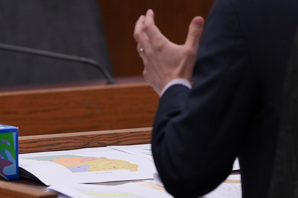 Missouri state Rep. Dirk Deaton, R-Seneca, sponsor of a bill that would redraw the state's U.S. House districts, testifies as a proposed map is seen on the table during a committee hearing on the bill , hursday, Sept. 4, 2025, in Jefferson City, Mo. (AP Photo/Jeff Roberson)