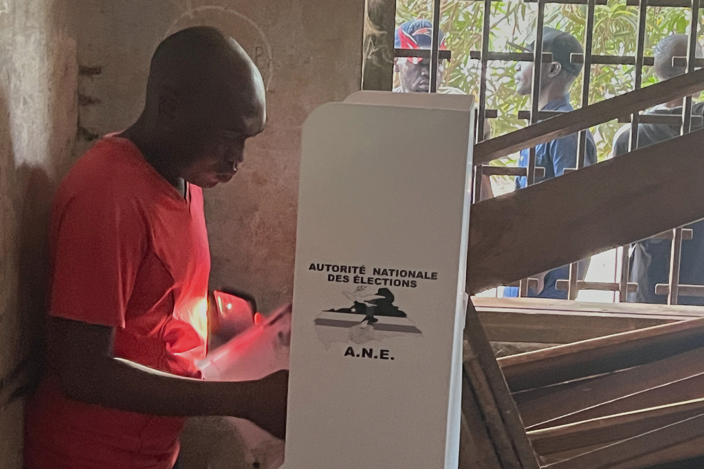 A man casts his ballot during the presidential election in Bangui, Central African Republic, Sunday, Dec. 28, 2025. (AP Photo/Jean-Fernand Koena)