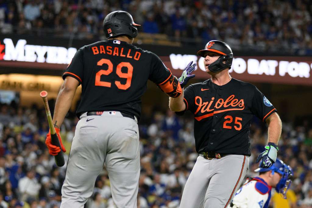 Baltimore Orioles' Pete Alonso, right, celebrates his solo home run with Samuel Basallo during the sixth inning of a baseball game against the Los Angeles Dodgers in Los Angeles, Friday, June 19, 2026. (AP Photo/Kyusung Gong)