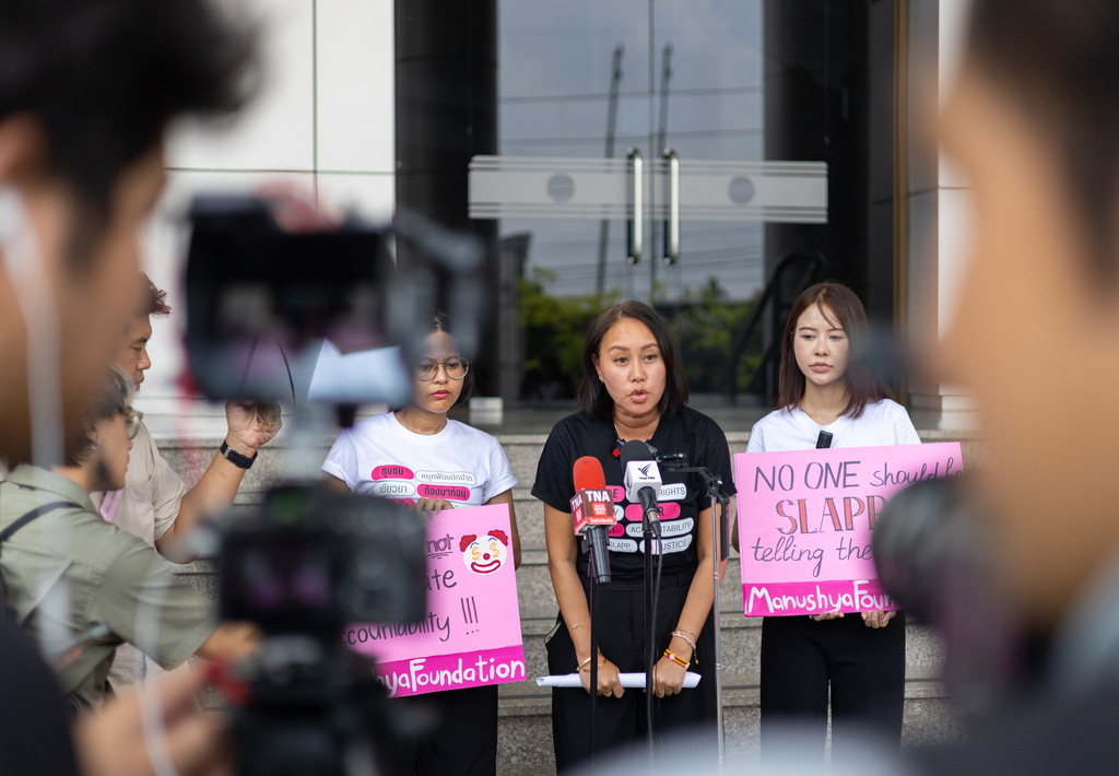 Emilie Palamy Pradichit, with the Manushya Foundation, speaks in front of the Bangkok Civil Court in Bangkok, Thailand, on Tuesday, March 24, 2026. (AP Photo/Anton L. Delgado)