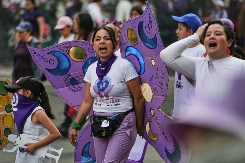 Demonstrators attend a protest marking International Day for the Elimination of Violence Against Women in Mexico City, Tuesday, Nov. 25, 2025. (AP Photo/Claudia Rosel)