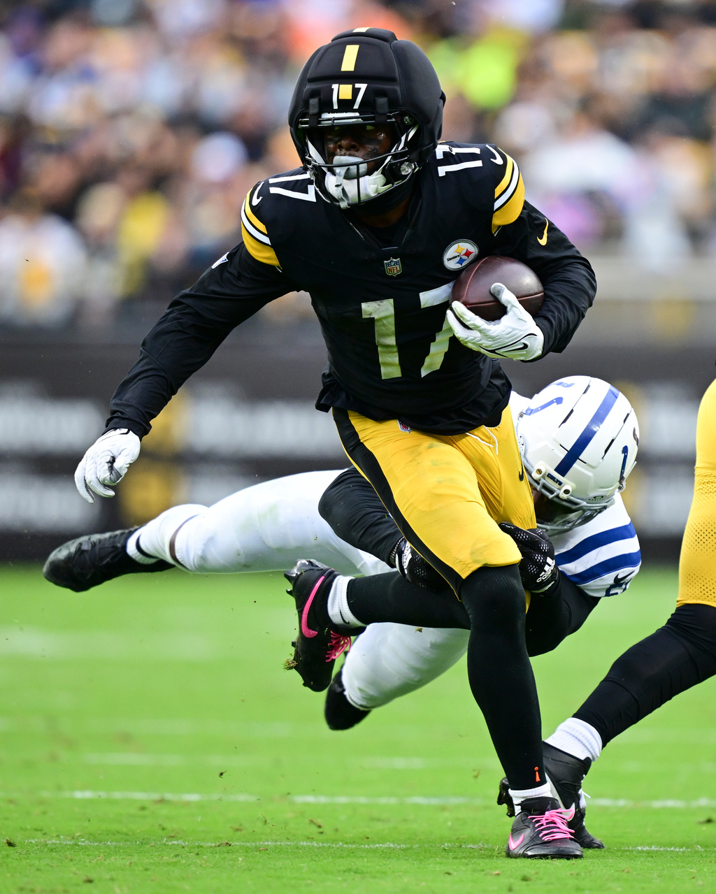 Pittsburgh Steelers wide receiver Germie Bernard (17) is tackled by Indianapolis Colts linebacker Akeem Davis-Gaither (51) during the first half of an NFL football game in Pittsburgh, Sunday, Oct. 11, 2026. (AP Photo/David Dermer )