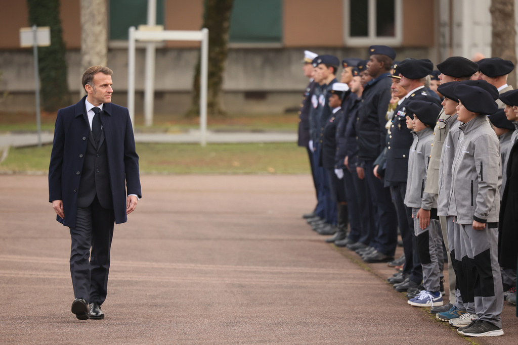 France's President Emmanuel Macron, reviews troops and students of an army high school prior to his speech at the military base in Varces, French Alps, Thursday, Nov. 27, 2025.(AP Photo/Thomas Padilla, Pool)