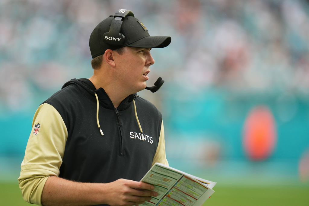 New Orleans Saints head coach Kellen Moore watches the game from the sidelines during the second half of an NFL football game against the Miami Dolphins Sunday, Nov. 30, 2025, in Miami Gardens, Fla. (AP Photo/Lynne Sladky)