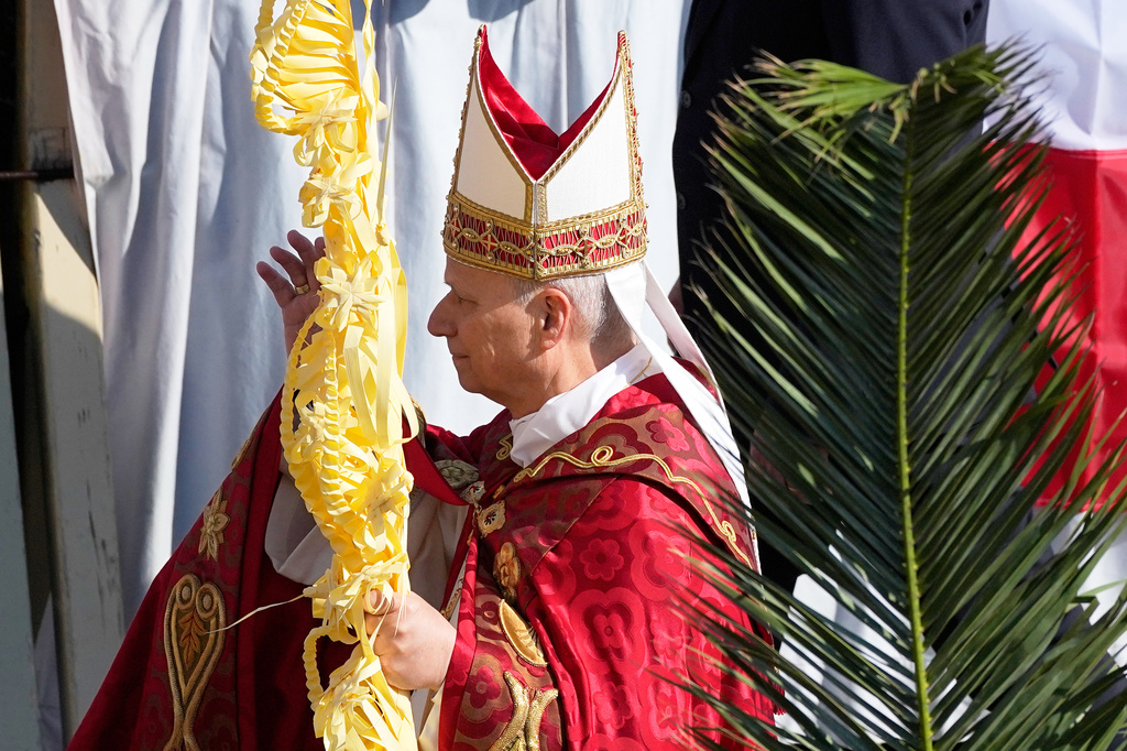 Pope Leo XIV presides over Mass in St. Peter's Square at the Vatican on the Catholic feast of Palm Sunday, commemorating Jesus' arrival in Jerusalem, Sunday, March 29, 2026. (AP Photo/Alessandra Tarantino)