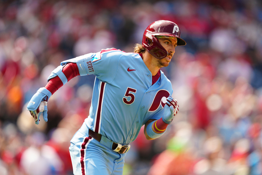 Philadelphia Phillies' Bryson Stott runs after hitting an RBI triple off San Francisco Giants pitcher Ryan Walker during the ninth inning of the first baseball game of a doubleheader, Thursday, April 30, 2026, in Philadelphia. (AP Photo/Derik Hamilton)