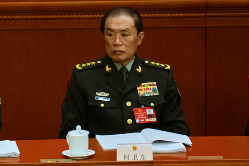 He Weidong, then vice-chair of the powerful Central Military Commission attends the opening session of the National People's Congress (NPC) at the Great Hall of the People in Beijing, China, on March 5, 2025. (AP Photo/Ng Han Guan) He Weidong, then vice-chair of the powerful Central Military Commission attends the opening session of the National People's Congress (NPC) at the Great Hall of the People in Beijing, China, on March 5, 2025. (AP Photo/Ng Han Guan)