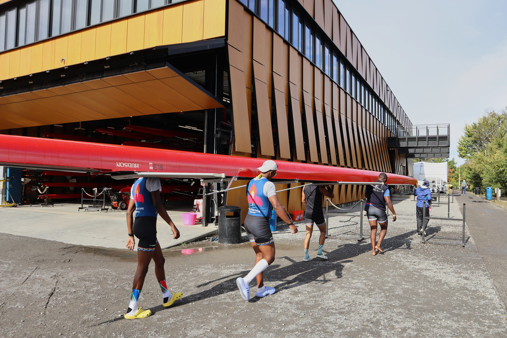 South African rowers carry their boat after practice Wednesday, Oct. 15, 2025, in Boston. (AP Photo/Leah Willingham)