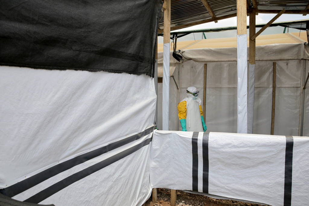 A health worker pauses after disinfecting a treatment center for Ebola patients, in Beni, North Kivu province, eastern Congo, Monday, Aug. 31, 2026. (AP Photo/Sebastien Kitsa Musayi)