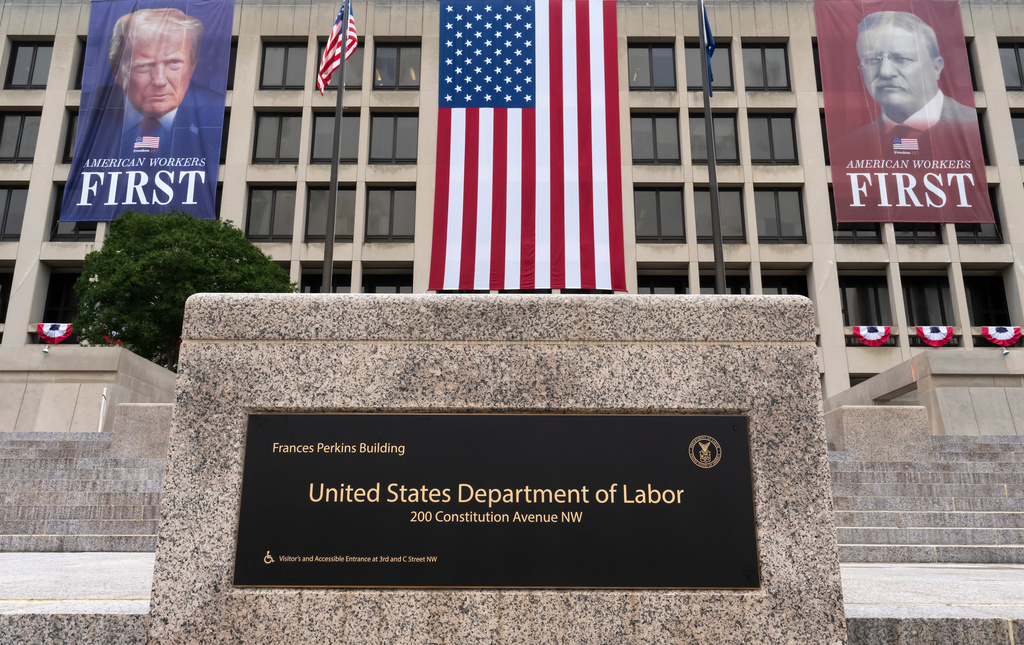 FILE - Portraits of Presidents Donald Trump and Theodore Roosevelt hang above the Department of Labor in Washington, July 7, 2026. (AP Photo/J. Scott Applewhite, File)