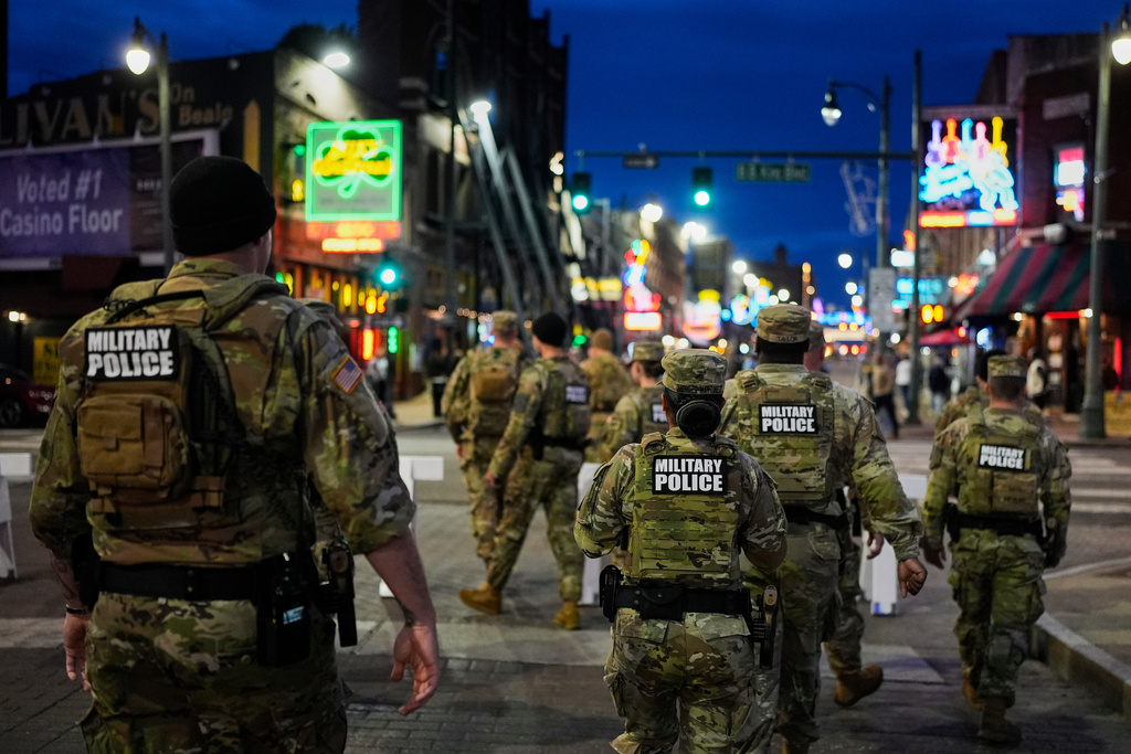 Members of the National Guard patrol along Beale Street, Friday, Oct. 24, 2025, in Memphis, Tenn. (AP Photo/George Walker IV)