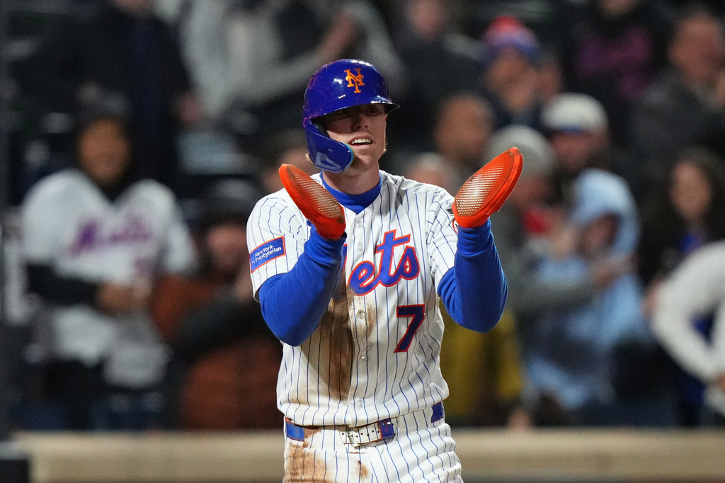 New York Mets' Brett Baty (7) celebrates after scoring on a single by Mark Vientos during the eighth inning of a baseball game against the Minnesota Twins Wednesday, April 22, 2026, in New York. (AP Photo/Frank Franklin II)