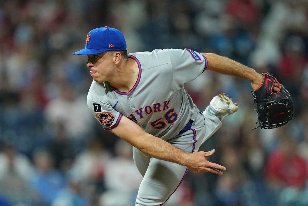FILE - New York Mets pitcher Ryan Helsley throws during the eighth inning of a baseball game Sept. 10, 2025, in Philadelphia. (AP Photo/Matt Rourke, File)
