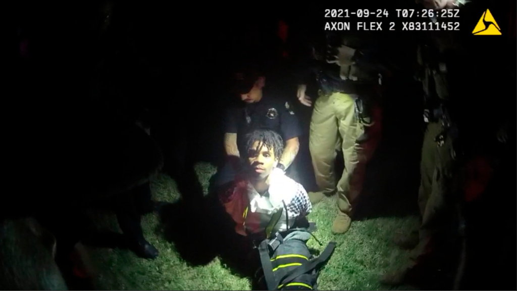 FILE - In this image from body camera video provided by Sedgwick County, police put Cedric "C.J." Lofton, 17, into a body-length restraining device called a WRAP outside his home in Wichita, Kan., on Sept. 24, 2021. (Sedgwick County via AP, File)