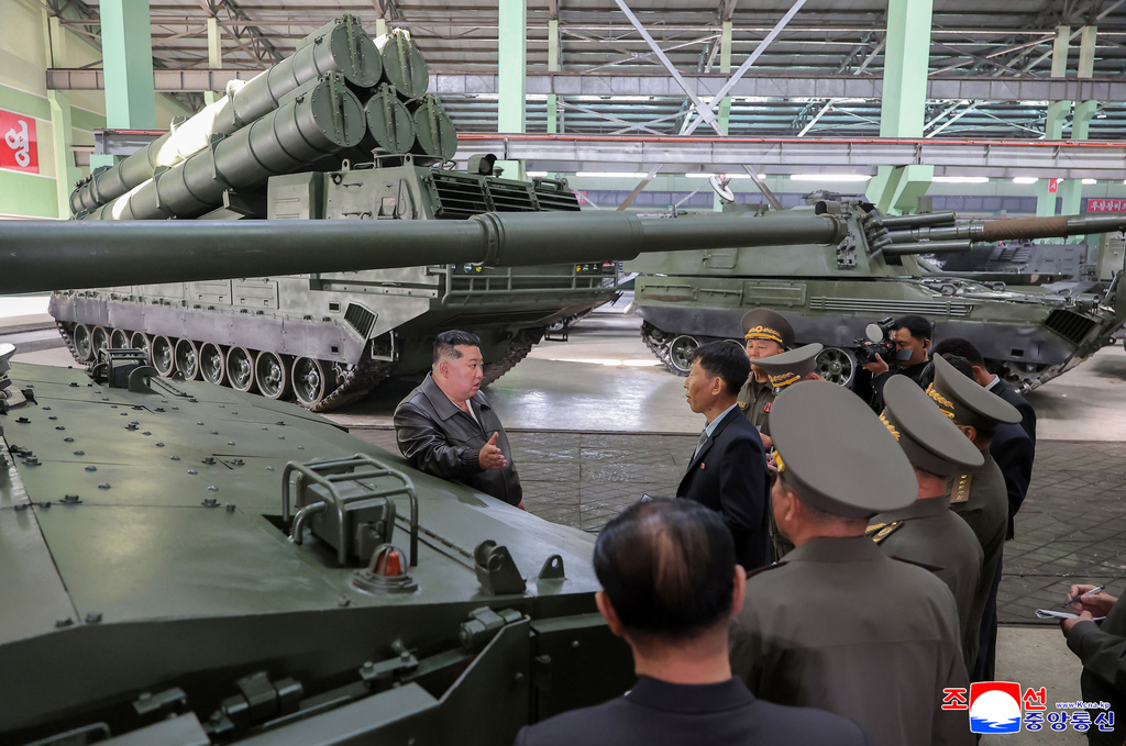 In this photo provided on May 8, 2026, by the North Korean government, its leader Kim Jong Un, center, visits a major munitions factory at an undisclosed location, North Korea Wednesday, May 6, 2026. Independent journalists were not given access to cover the event depicted in this image distributed by the North Korean government. The content of this image is as provided and cannot be independently verified. Korean language watermark on image as provided by source reads: "KCNA" which is the abbreviation for Korean Central News Agency. (Korean Central News Agency/Korea News Service via AP)