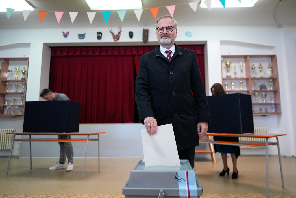 Czech Republic's Prime Minister and leader of coalition of three conservative parties called "Together" Petr Fiala casts his ballot at a polling station for a general election in Brno, Czech Republic, Friday, Oct. 3, 2025. (AP Photo/Darko Bandic)