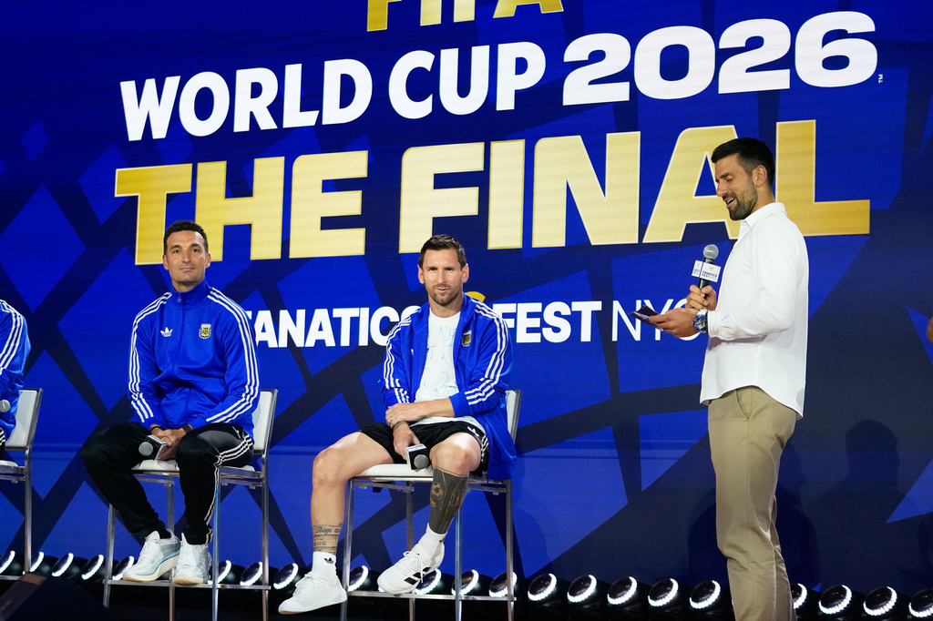 Argentina's Lionel Messi, head coach Lionel Scaloni listens to tennis player Novak Djokovic during a news conference ahead of the World Cup final soccer match between Spain and Argentina in New York, Friday, July 17, 2026. (AP Photo/Frank Franklin II)