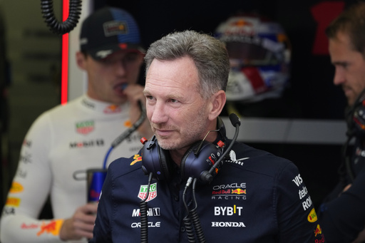 Red Bull team principal Christian Horner stands in his team garage during the third practice session ahead of the Formula One Bahrain Grand Prix at the Bahrain International Circuit in Sakhir, Bahrain, Friday, March 1, 2024. (AP Photo/Darko Bandic)