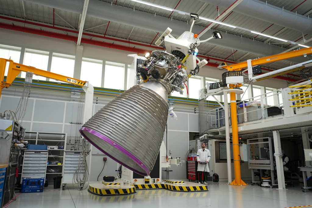 A mechanic works on the Vulcain 2.1 engine that powers the Ariane 64 rocket, at the ArianeGroup's plant in Vernon, west of Paris, Wednesday, Feb. 4, 2026. (AP Photo/Thibault Camus)