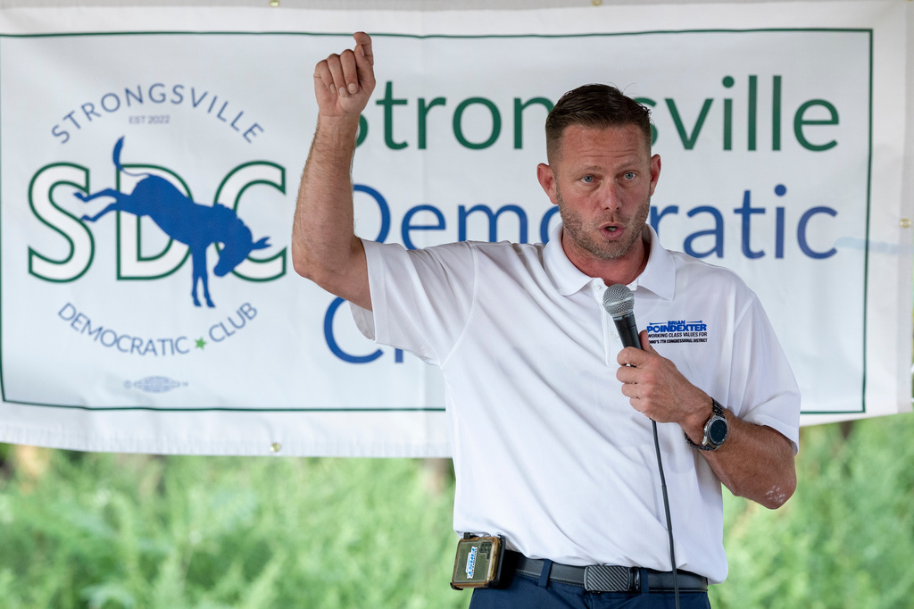 Brian Poindexter, Democratic nominee for Ohio's 7th congressional district, speaks at the Strongsville Democratic Club meeting, Wednesday, Aug. 5, 2026, in Strongsville, Ohio. (AP Photo/Nate Manley)