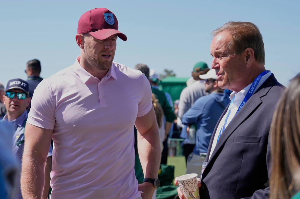 FILE - Former NFL player J.J. Watt, left, talks with sportscaster Jim Nantz during the final round at the Masters golf tournament, April 13, 2025, in Augusta, Ga. (AP Photo/Ashley Landis, File)