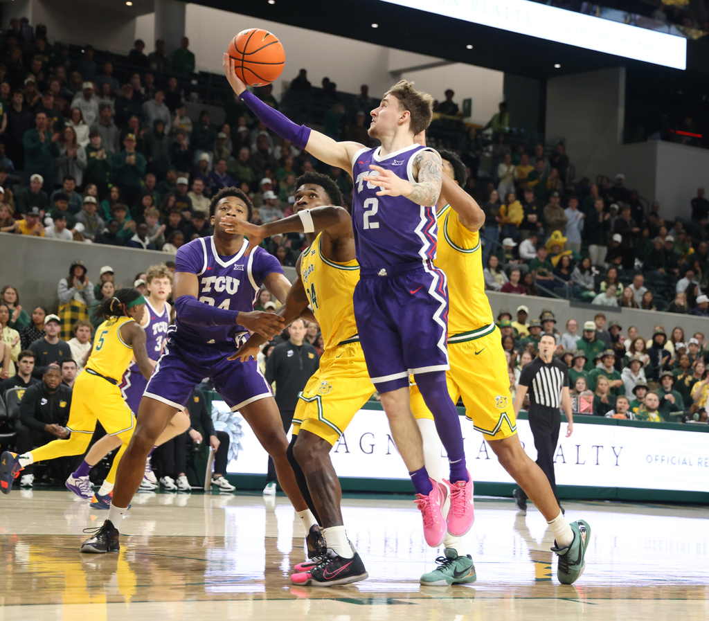 TCU guard Brock Harding scores over Baylor center Caden Powell in the first half of an NCAA college basketball game, Saturday, Jan. 24, 2026, in Waco, Texas. (Rod Aydelotte/Waco Tribune-Herald, via AP)