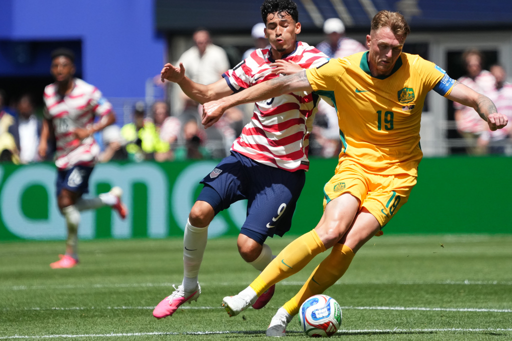 United States' Ricardo Pepi (9) and Australia's Harry Souttar (19) fight for the ball during the World Cup Group D soccer match between the United States and Australia in Seattle, Friday, June 19, 2026. (AP Photo/Ted S. Warren)