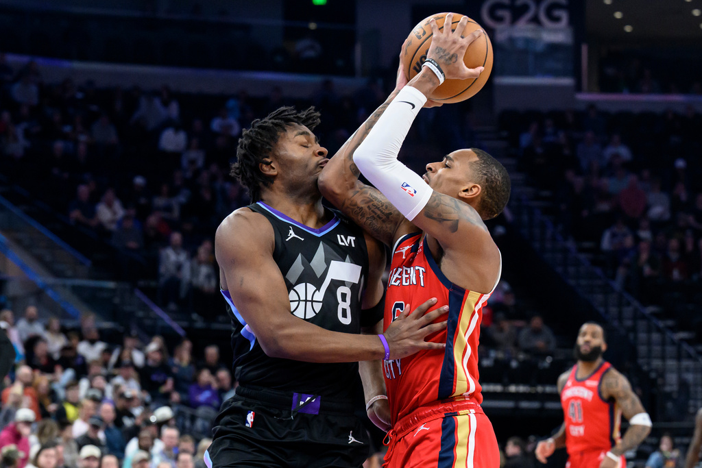 New Orleans Pelicans guard Dejounte Murray (5) elbows Utah Jazz guard Isaiah Collier (8) in the face as he drives to the basket during the first half of an NBA basketball game, Thursday, Feb. 26, 2026, in Salt Lake City. (AP Photo/Tyler Tate)