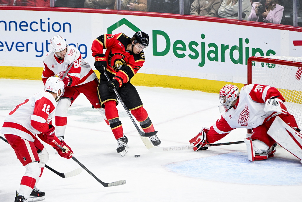 Ottawa Senators' Ridly Greig (71) looks for a shot on goal against Detroit Red Wings' goaltender John Gibson (36) during the third period of an NHL hockey game, in Ottawa, Ontario, Thursday, Feb. 26, 2026. (Spencer Colby/The Canadian Press via AP)