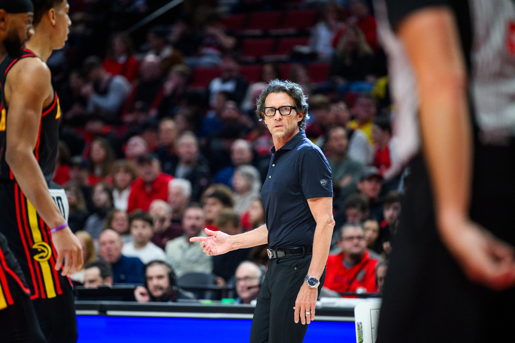 Atlanta Hawks Head Coach Quin Snyder looks to the referees during the first half of an NBA basketball game against the Portland Trail Blazers on Thursday, Jan. 15, 2026, in Portland, Ore. (AP Photo/Molly J. Smith)
