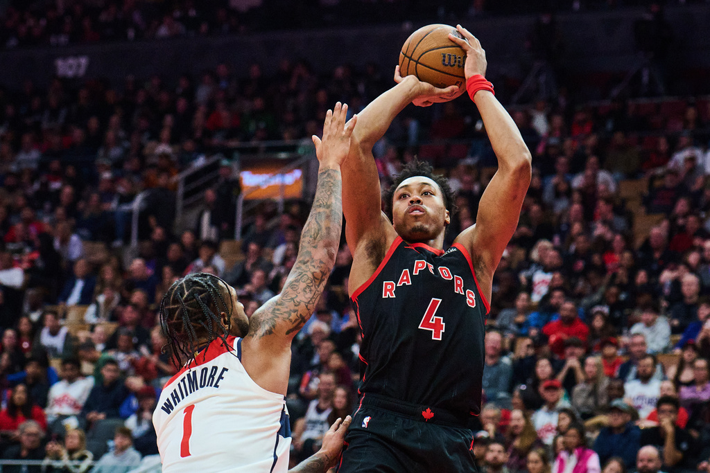 Toronto Raptors' Scottie Barnes (4) shoots over Washington Wizards' Cam Whitmore (1) during first half NBA Cup basketball action in Toronto, Friday, Nov. 21, 2025. (Sammy Kogan/The Canadian Press via AP)