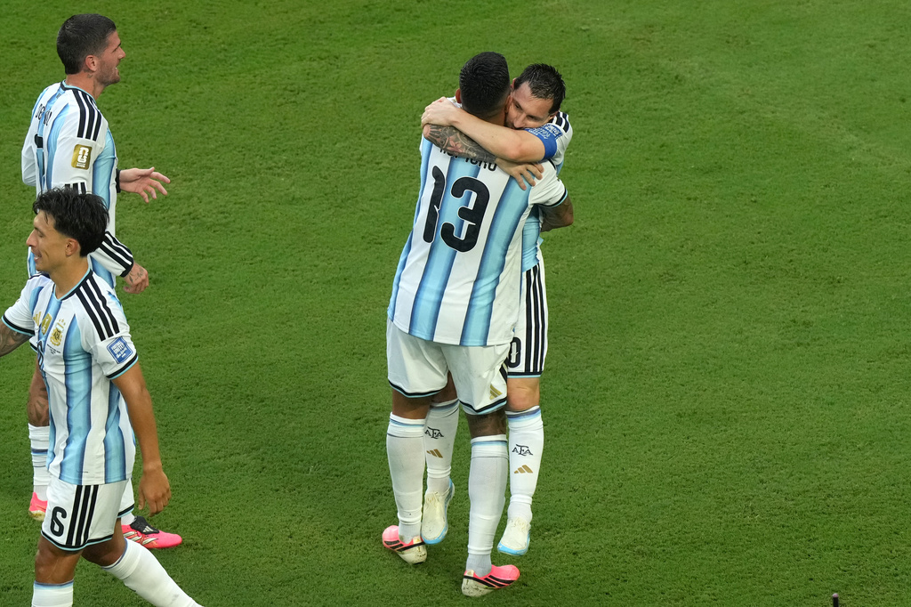 Argentina's Lionel Messi (10) celebrates with Cristian Romero (13) after scoring their first goal during the World Cup round of 32 soccer match between Argentina and Cape Verde in Miami Gardens, Fla., Friday, July 3, 2026. (AP Photo/Marta Lavandier)