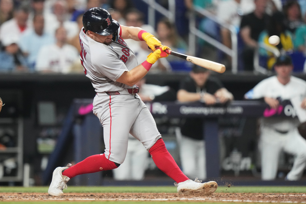 Boston Red Sox's Caleb Durbin hits a single during the fifth inning of a baseball game against the Miami Marlins, Monday, Aug. 24, 2026, in Miami. (AP Photo/Lynne Sladky)