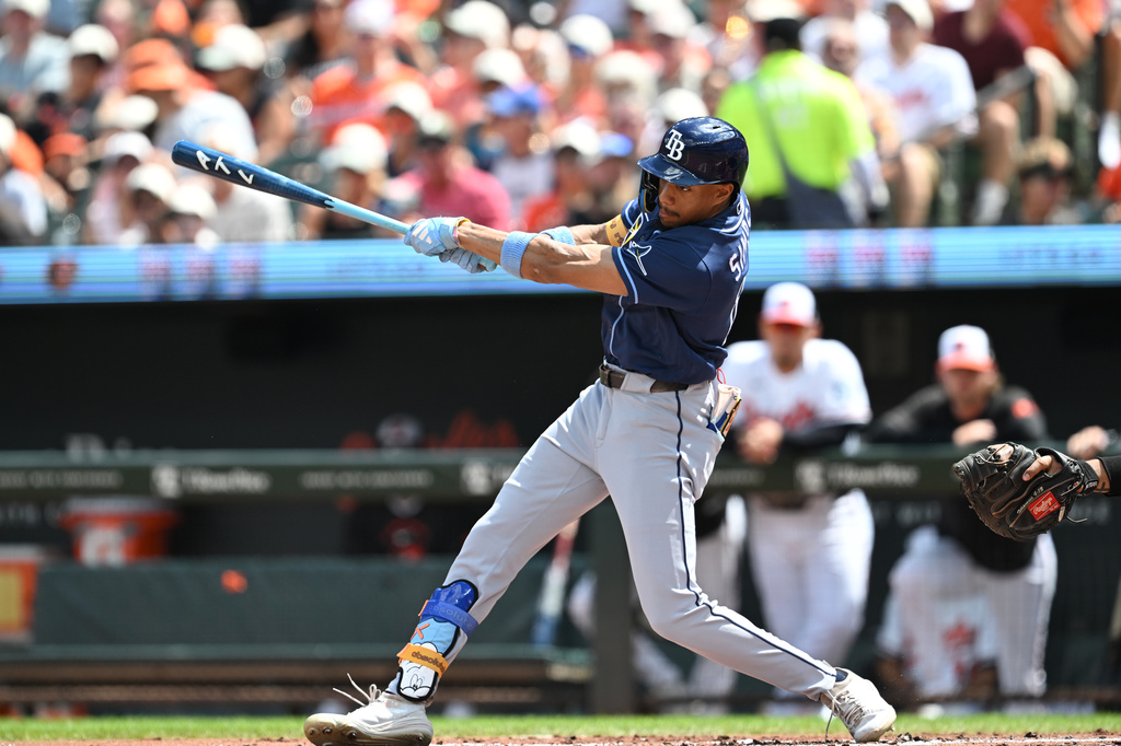 Tampa Bay Rays' Chandler Simpson follows through on a single against the Baltimore Orioles in the second inning of a baseball game Sunday, Aug. 23, 2026, in Baltimore. (AP Photo/Gail Burton)