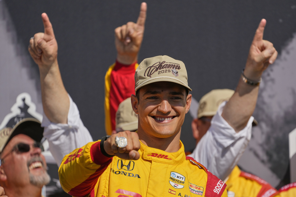 Alex Palou celebrates after winning the IndyCar championship Sunday, Aug. 31, 2025, at Nashville Superspeedway in Lebanon, Tenn. (AP Photo/George Walker IV)