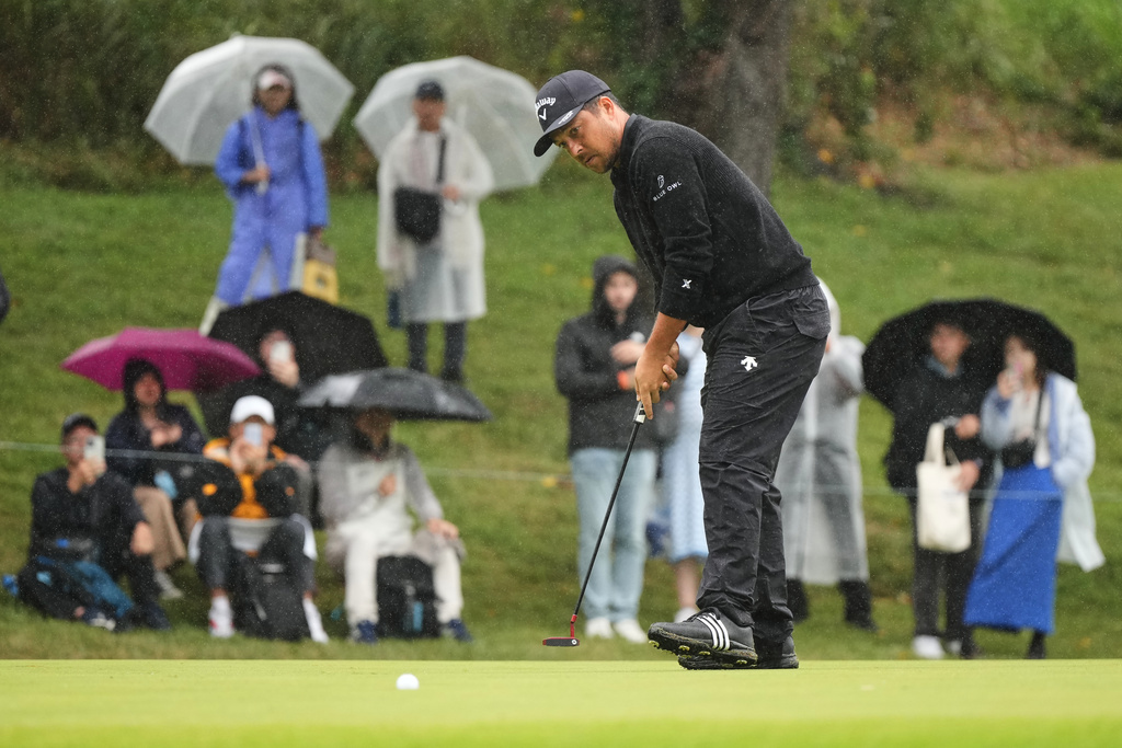 Xander Schauﬀele, of the U.S., makes a putter shot on the second green during the third round of the Baycurrent Classic golf tournament at the Yokohama Country Club in Yokohama, near Tokyo, Saturday, Oct. 11, 2025. (AP Photo/Hiro Komae)