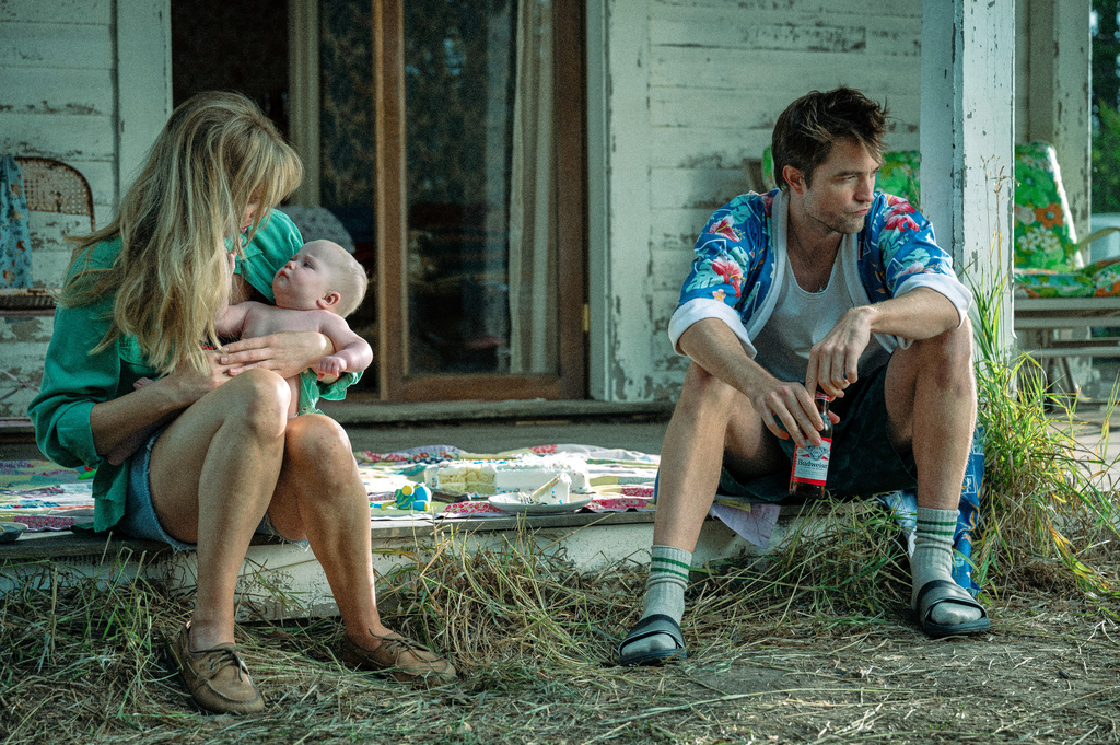 This image released by Mubi shows Jennifer Lawrence, left, and Robert Pattinson in a scene from "Die My Love." (Kimberly French/Mubi via AP)