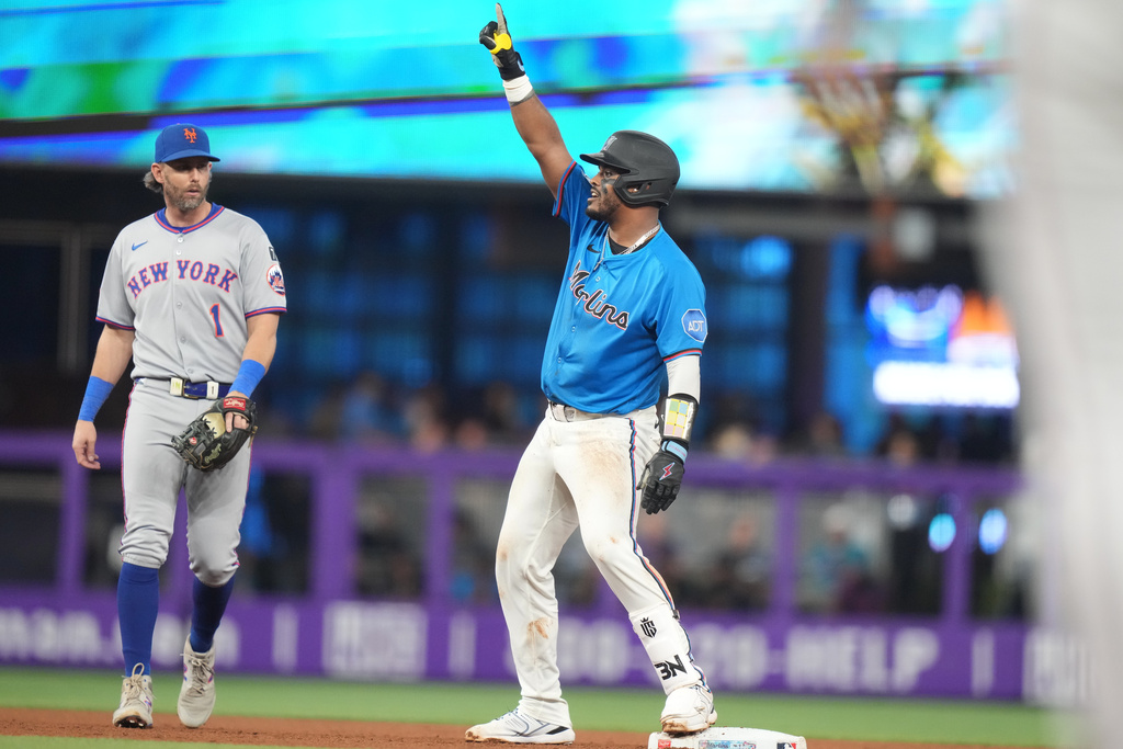 Miami Marlins' Brian Navaretto reacts after hitting a RBI double to score Eric Wagaman during the fourth inning of a baseball game against the New York Mets, Sunday, Sept. 28, 2025, in Miami. (AP Photo/Lynne Sladky)