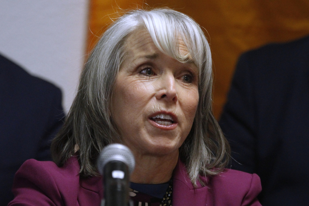 New Mexico Gov. Michelle Lujan Grisham speaks during a news conference, Tuesday, March 10, 2026, in Santa Fe, N.M., after signing legislation that bars federal immigration agents from election polling sites in New Mexico, in a step being considered by several other Democratic-led states. (AP Photo/Morgan Lee)