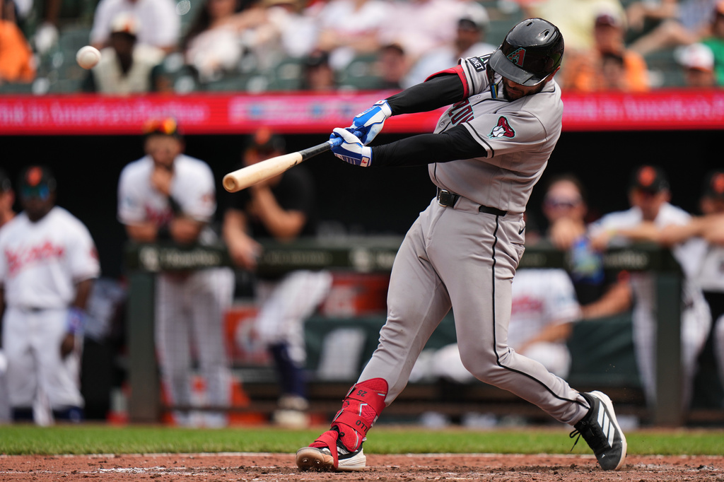 Arizona Diamondbacks' Adrian del Castillo hits a two-run home run during the 10th inning of a baseball game against the Baltimore Orioles, Wednesday, April 15, 2026, in Baltimore. (AP Photo/Stephanie Scarbrough)