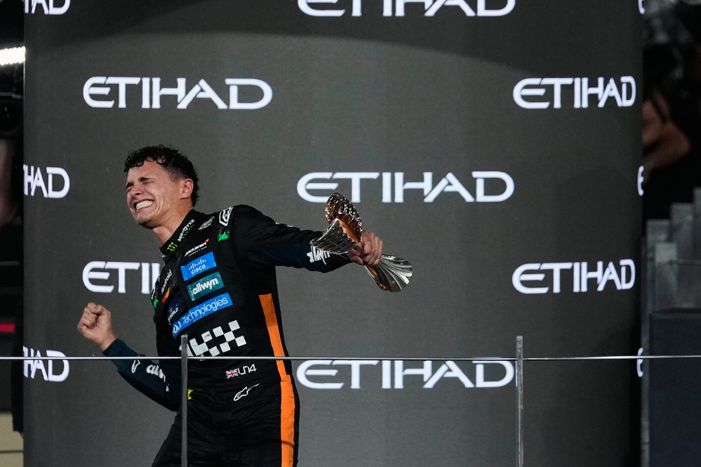 McLaren driver Lando Norris of Britain celebrates after becoming a world champion after the Formula One Abu Dhabi Grand Prix at the Yas Marina Circuit in Abu Dhabi, UAE, Sunday, Dec. 7, 2025. (AP Photo/Altaf Qadri)