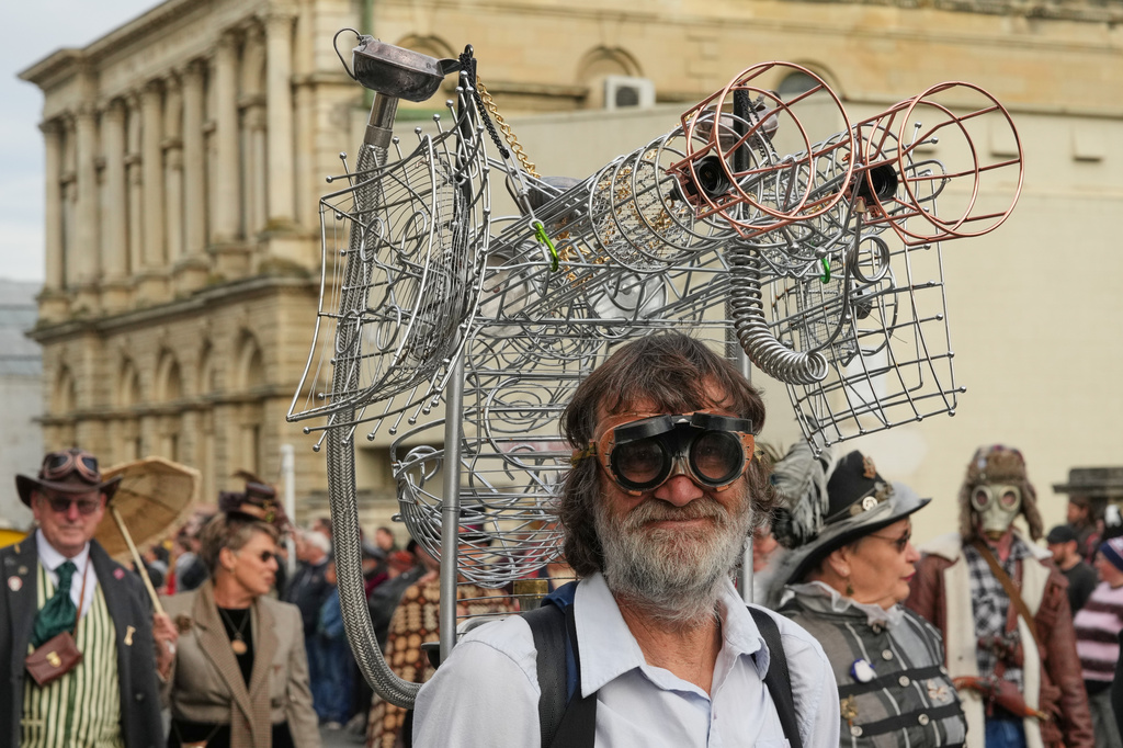 A participant reacts as he marches in a parade at the Steampunk NZ Festival in Ōamaru, New Zealand, on May 30 2026. (AP Photo/Charlotte Graham-McLay)