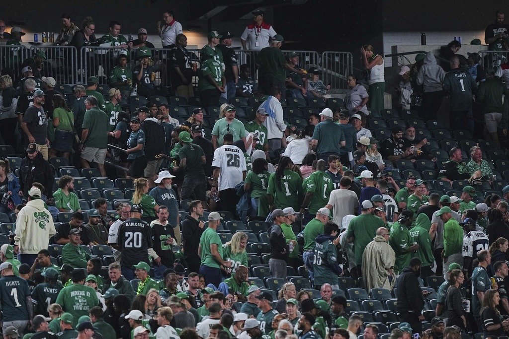 Fans file out of the seating area and head toward the concourse level after a severe thunderstorm warning was issued in the second half of an NFL football game between the Dallas Cowboys and Philadelphia Eagles Thursday, Sept. 4, 2025, in Philadelphia. (AP Photo/Matt Rourke)
