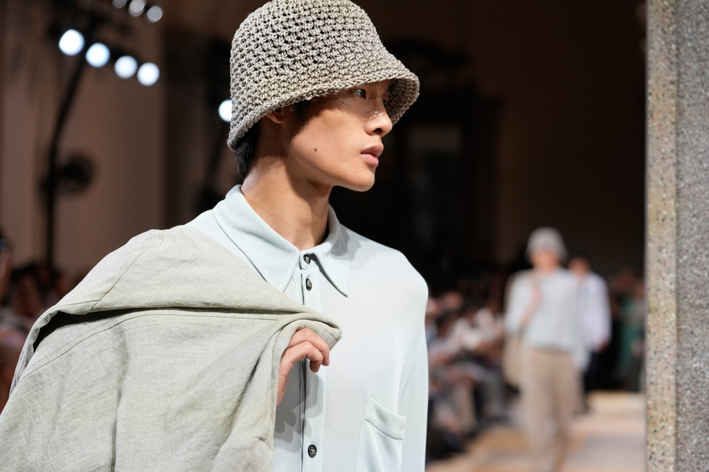 A model wears a creation as part of the Giorgio Armani Spring/Summer 2027 men's collection presented in Milan, Italy, Monday, June 22, 2026. (AP Photo/Luca Bruno)