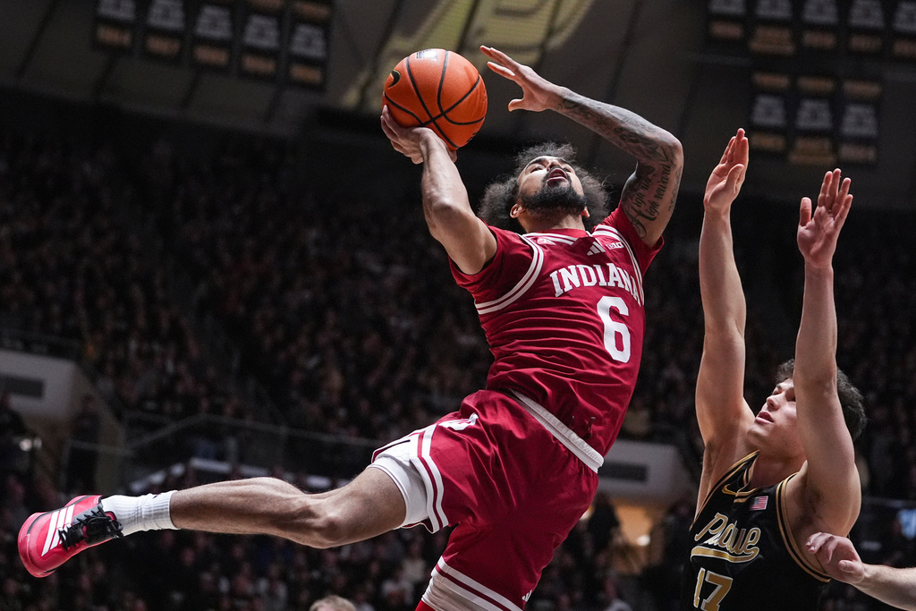 Indiana guard Tayton Conerway (6) shoots over Purdue guard Omer Mayer (17) during the first half of an NCAA college basketball game in West Lafayette, Ind., Friday, Feb. 20, 2026. (AP Photo/Michael Conroy)