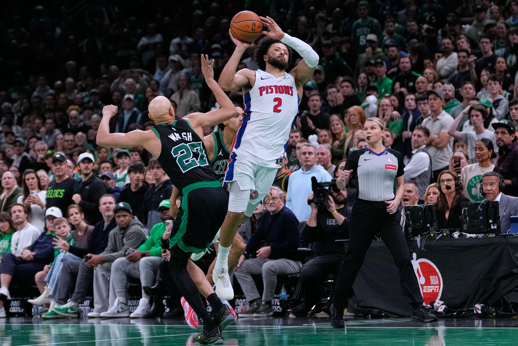 Detroit Pistons guard Cade Cunningham (2) is fouled by Boston Celtics guard Jordan Walsh (27) during the final minute of the second half of an Emirates NBA Cup basketball game, Wednesday, Nov. 26, 2025, in Boston. (AP Photo/Charles Krupa)
