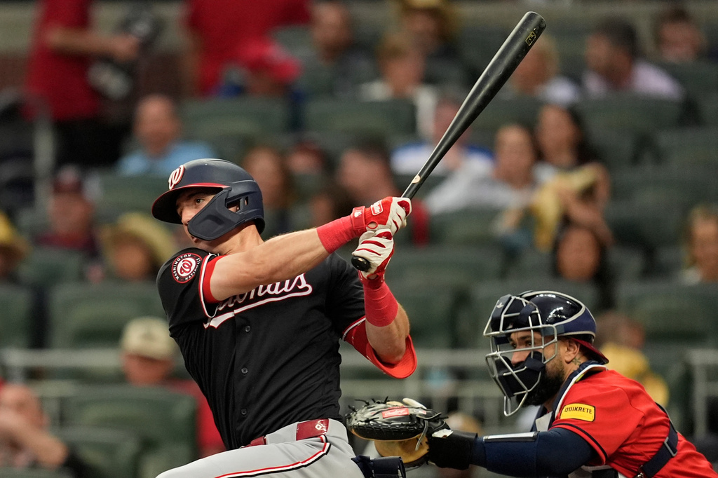 Washington Nationals' Jacob Young (30) hits a single in the fifth inning of a baseball game against the Atlanta Braves, Friday, May 22, 2026, in Atlanta. (AP Photo/Mike Stewart)