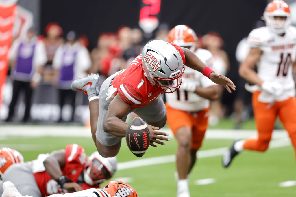 UNLV quarterback Alex Orji (1) fumbles after he was tripped by the Idaho State defense close to the end zone during the first half of an NCAA college football game Saturday, Aug. 23, 2025, in Las Vegas. (Steve Marcus/Las Vegas Sun via AP)