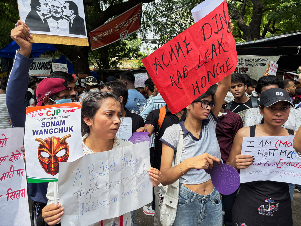 Protestors carry placards during a demonstration demanding educational reforms as part of the Cockroach Janta Party's ongoing protest movement in New Delhi, India, Thursday, July 23, 2026. (AP Photo/Shonal Ganguly)
