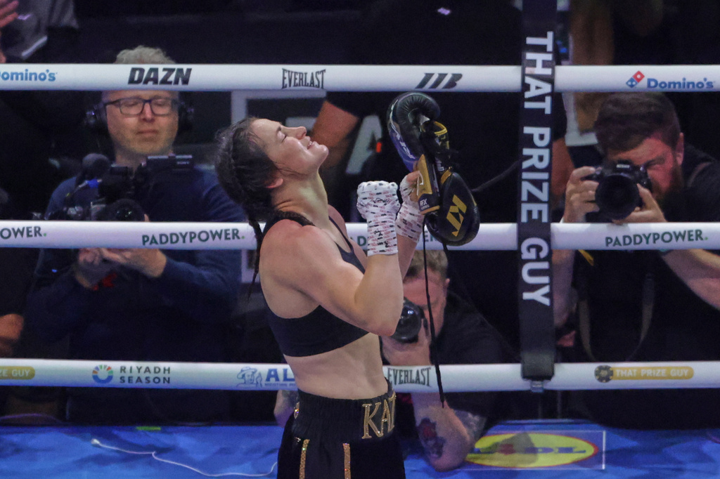 Ireland's Katie Taylor celebrates after beating Flora Pili of France in their super lightweight world title fight in Dublin, Saturday, Sept. 5, 2026. (AP Photo/Peter Morrison)